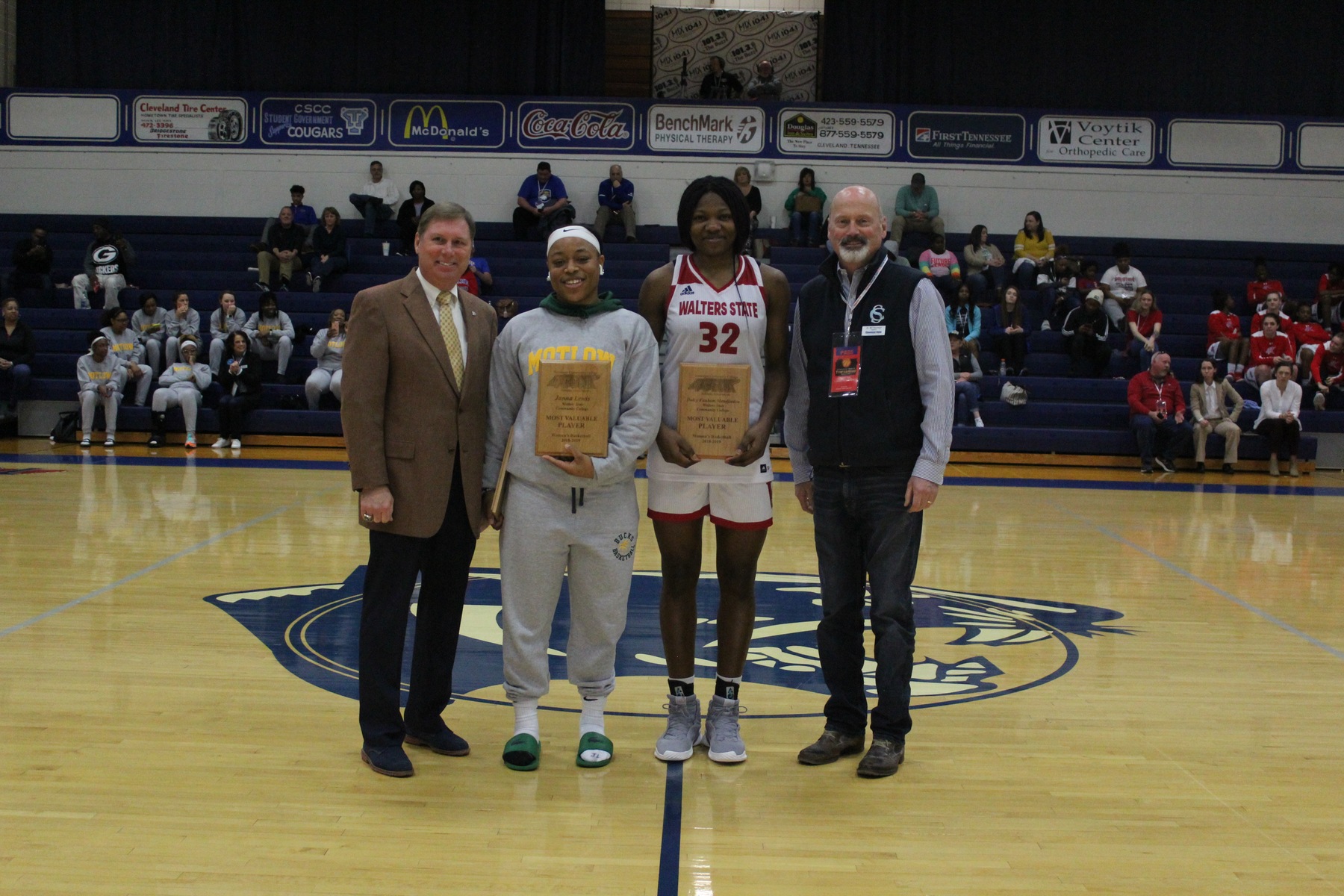 Janna Lewis (L) and Dulcy Fankam Mendjiadeu (R) are congratulated by Dr. Foster Chason, TCCAA Commissioner and Dr. Bill Seymour, TCCAA President, during Saturday's ceremony (courtesy of cscougars.com)